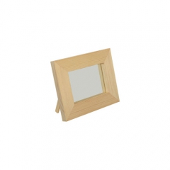 A small mirror in a wooden frame
