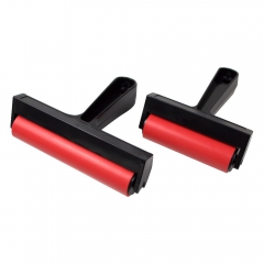 Rubber roller with a plastic handle